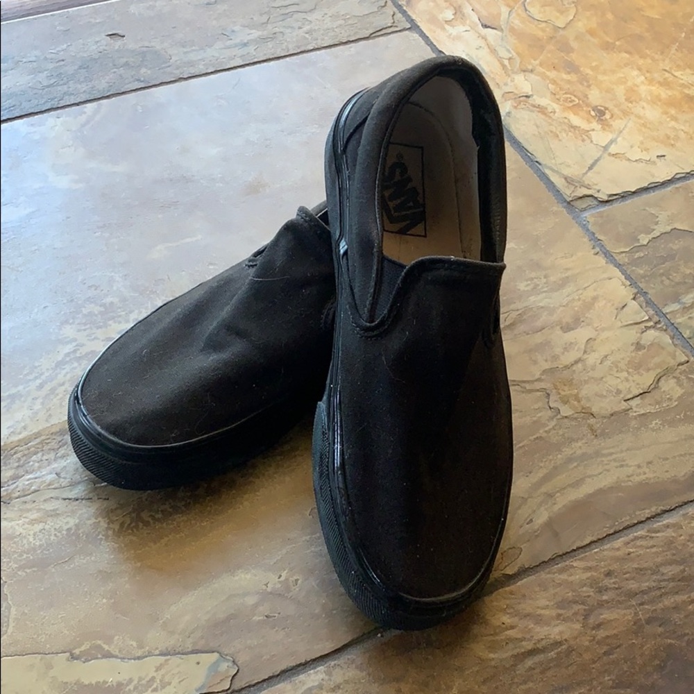 All black vans with gum bottoms